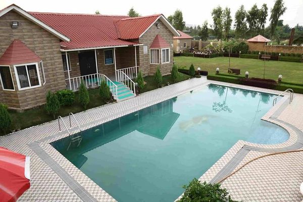 Luxury farmhouse in Noida with green landscape and open garden near Noida Expressway